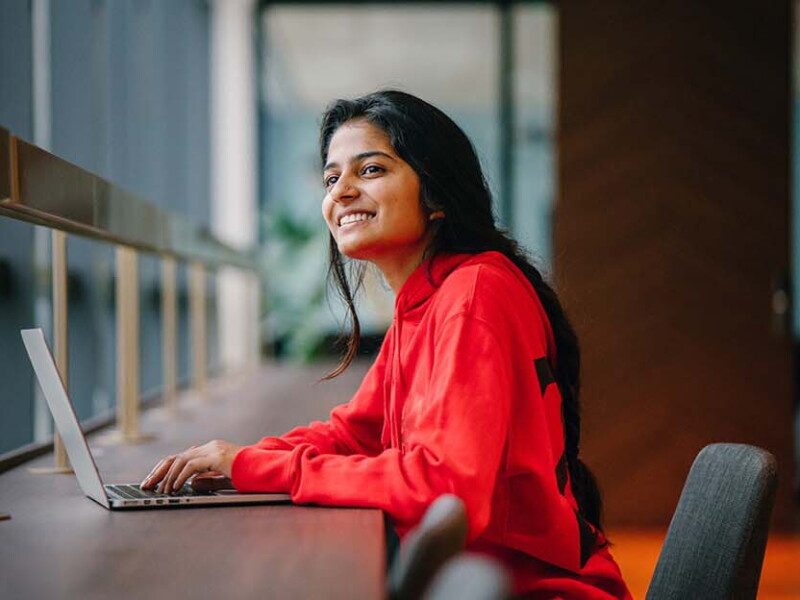 woman on laptop smiling