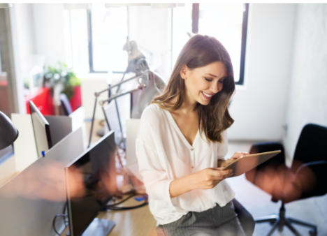 a person works on a tablet in an office space