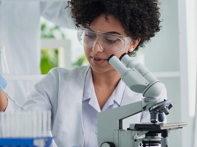 Diverse team of biomedical engineers working together in a lab