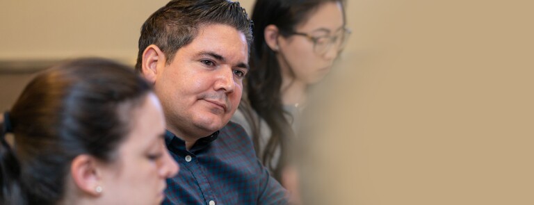 man paying attention to speaker