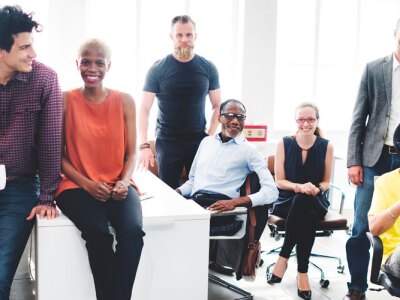 Business leader gathers with colleagues in the office to foster a good workplace.