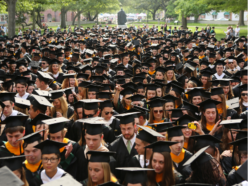 Students in caps and gowns at Commencement