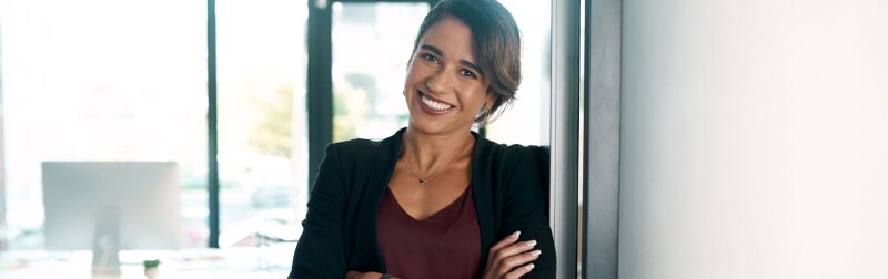 Corporate, woman and arms crossed promotes advocacy and justice for people.