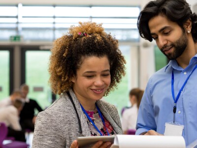 administrator and teacher looking at documents