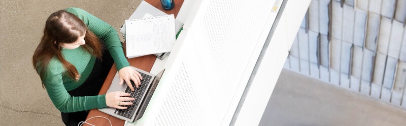 Female student working on her laptop