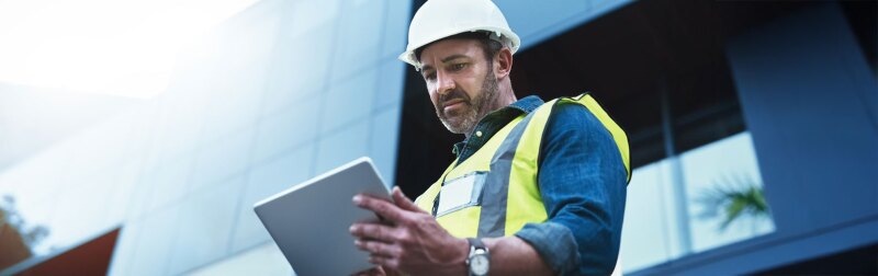 Shot of a engineer using a digital tablet on a construction site.