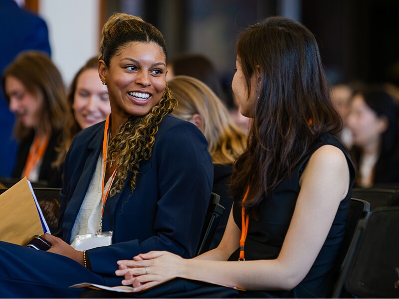 Two women talking at University of Illinois orientation.