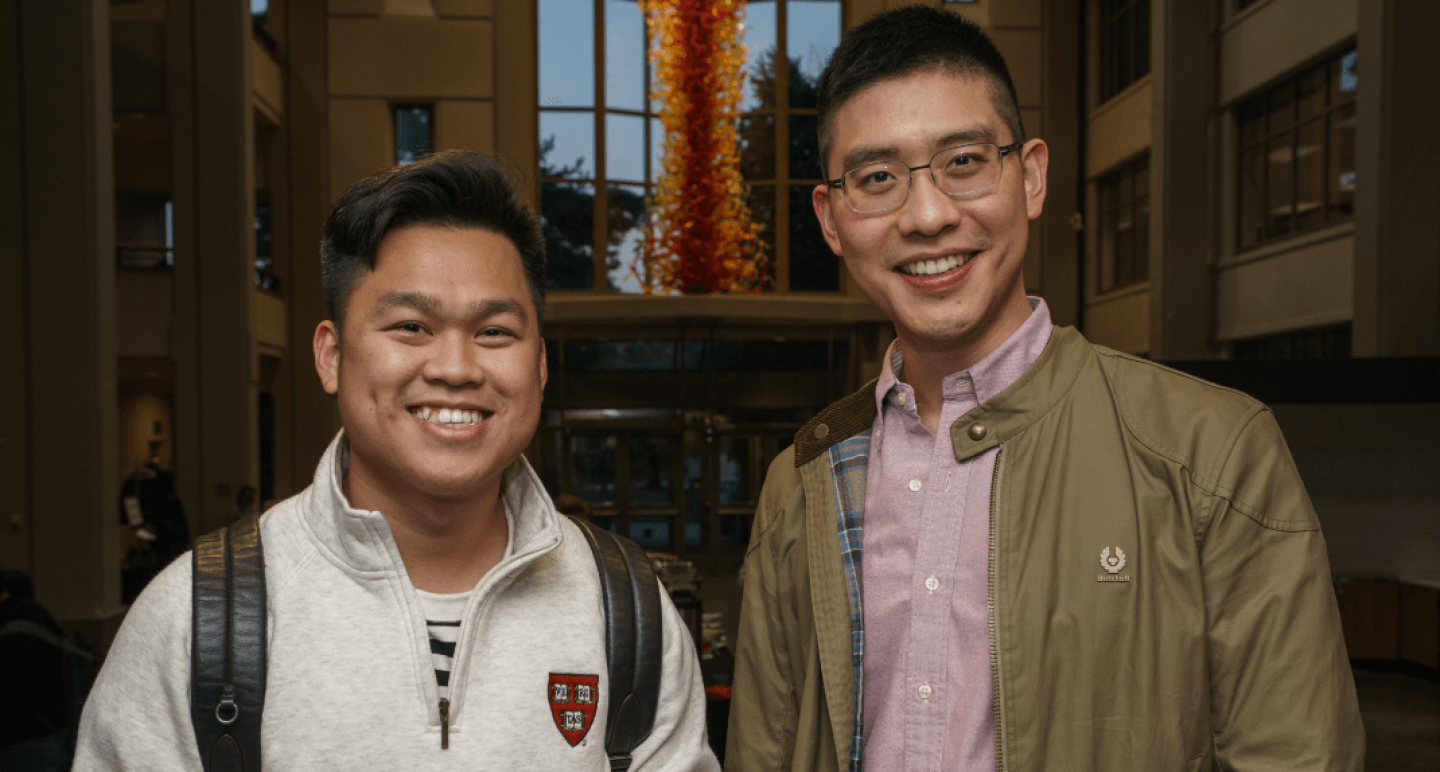 Two smiling Seattles students in campus building
