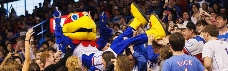 University of Kansas mascot Big Jay crowdsurfing with fans in the Allen Fieldhouse during a basketball game