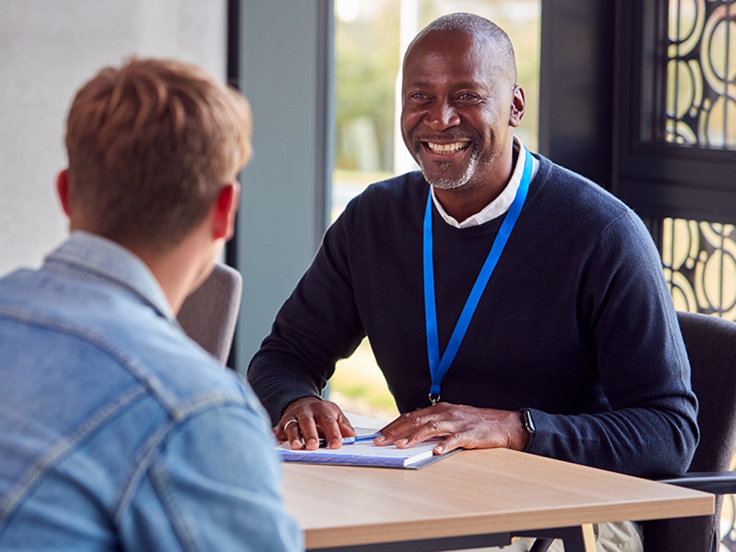 Student having a meeting with his counselor
