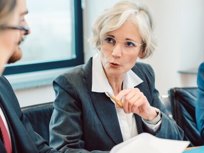 Professionals discussing legal and ethical issues during a meeting