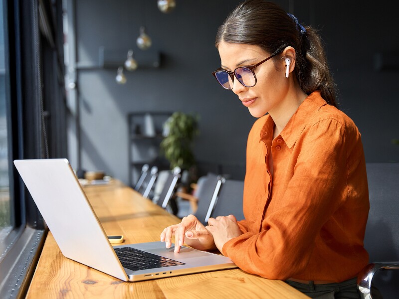 Female professional focused on her laptop