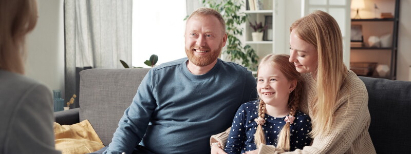 Couple and child sitting in a family therapy sessions