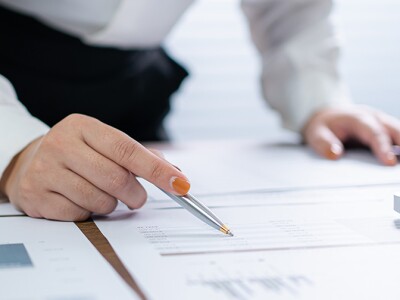 Business women checking looking over financial statements