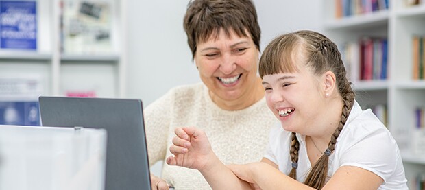 teacher-helping-special-needs-student