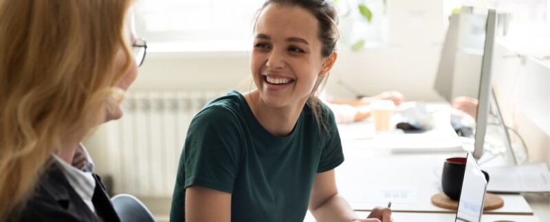 Happy coworkers discussing business
