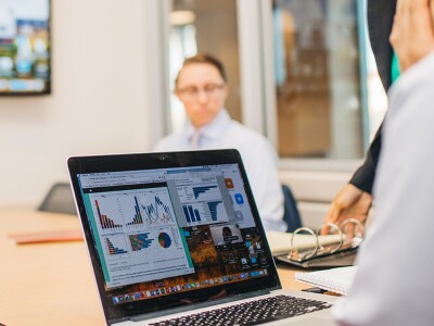 Marketing team reviewing data from an analytics dashboard