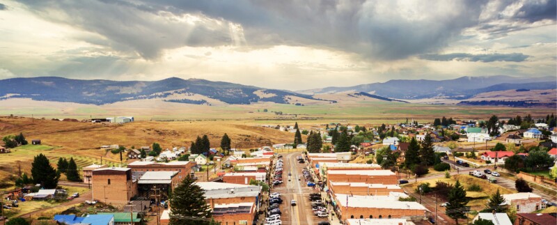Rural community with mountains in the background at sunrise