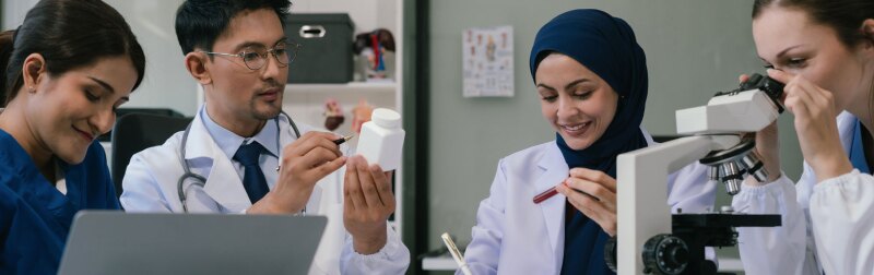 Doctor team, analysis the blood test examination results and medication usage of the patient on the chart, medical check-up concept.