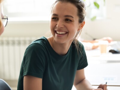 Happy coworkers discussing business