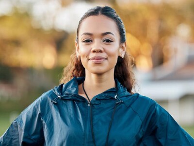 Confident female soccer manager on the field
