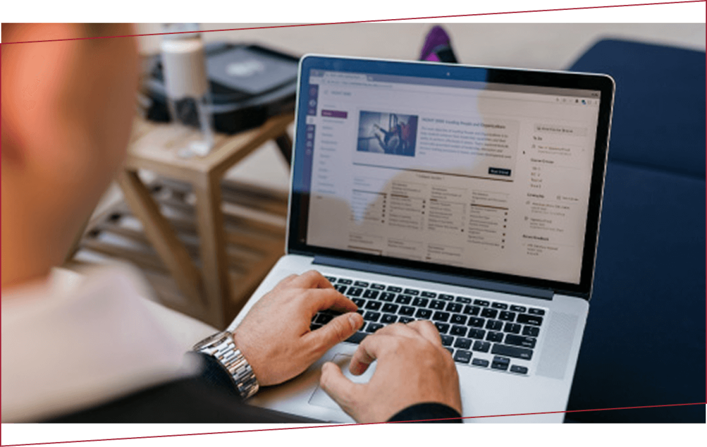 Person typing on laptop as seen from over their shoulder