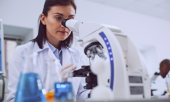 Concentrated biologist working in the lab