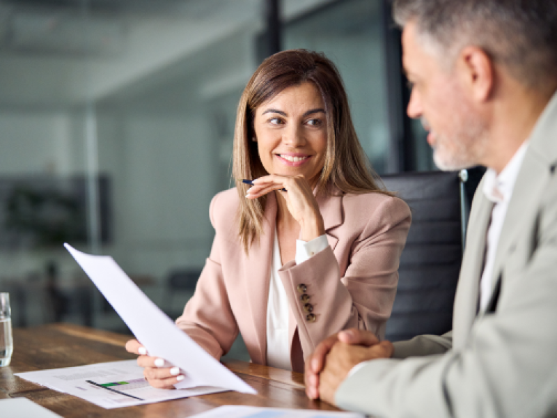 business man and woman meeting at a desk