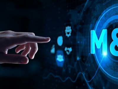 A hand pointing toward a digital display reading "M&A"