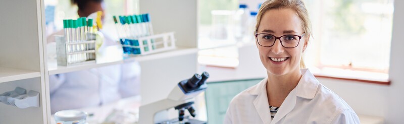 Smiling biomedical engineer in her lab