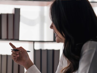 woman reading finance charts on screen