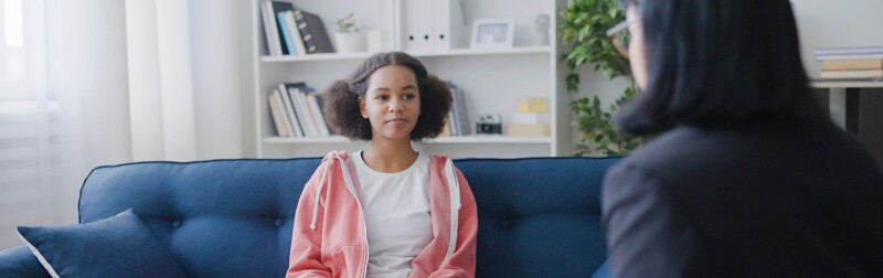 Teenager talking to female counselor