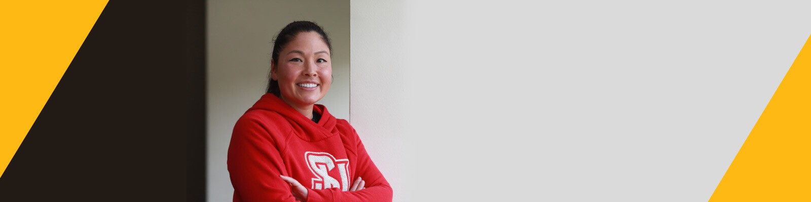 Woman wearing red Seattle University sweatshirt