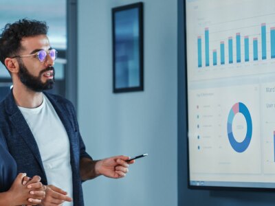 Company Operations Manager Holds Meeting Presentation.