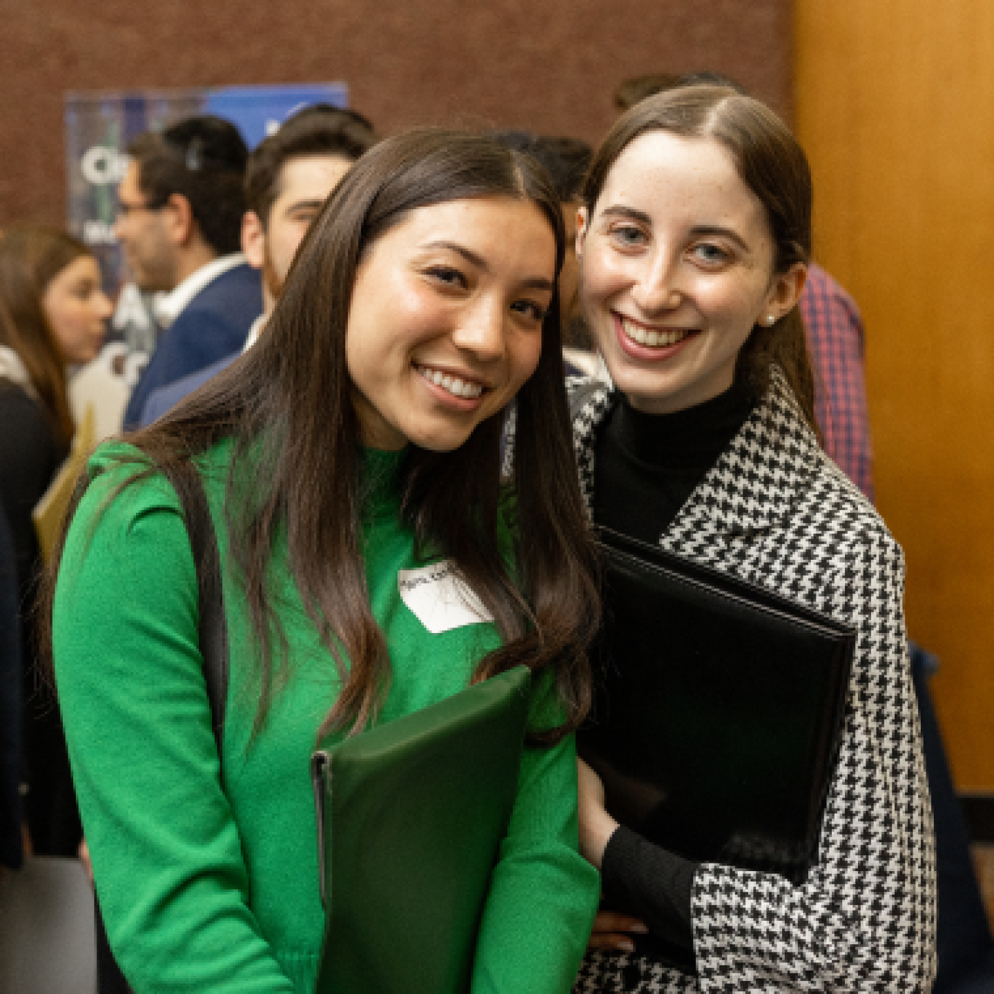 Two female Yeshiva University students smiling together.