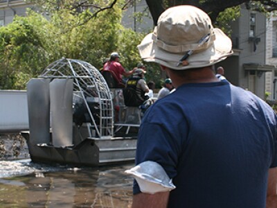 boat going down a flooded street