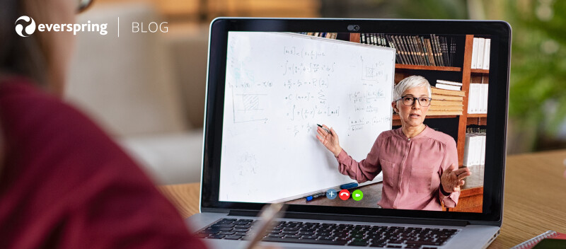 Woman virtually teaching through computer