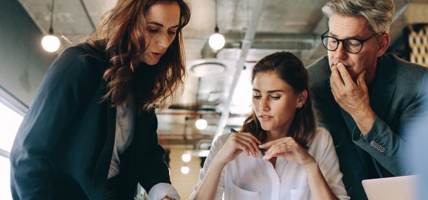 Three business professionals working together
