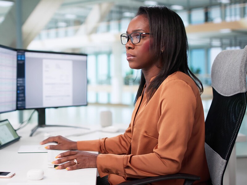 Health data analyst reviewing epidemiology charts and graphs