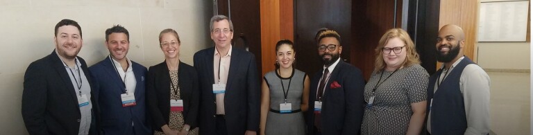 students, faculty, and speakers pose for photo at a Cardozo Law event