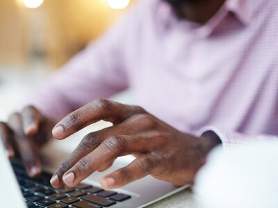 Close-up-Of-Hands-Typing-On-Laptop-Keyboard