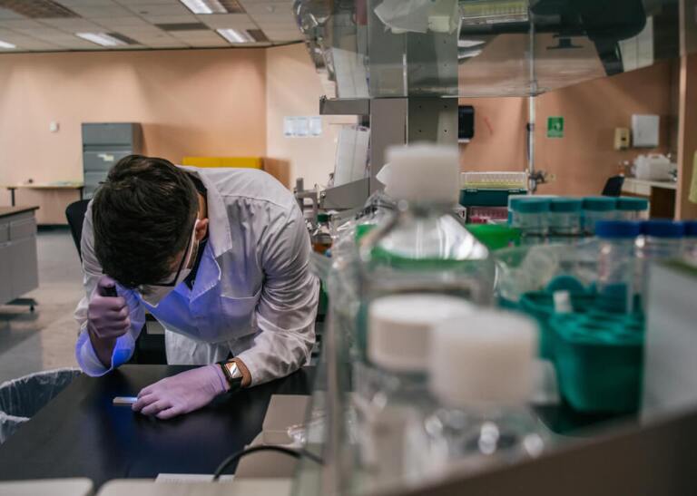 Health care lab technician preparing a specimen