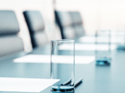 Empty boardroom with empty glasses of water on the table