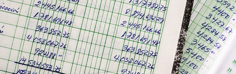 An old accounting ledger with handwritten financial data