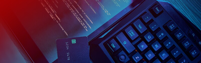 Credit card on top of keyboard and tablet computer