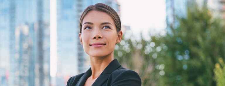 Happy-Businesswoman-Smiling-Outside