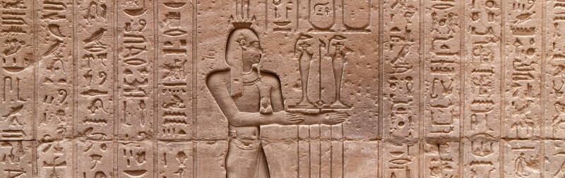 Hieroglyphs in a wall of Ruins of Temple of Horus at Edfu - Egypt