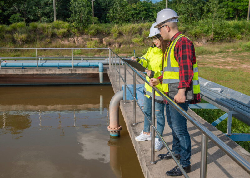 A manager and employee at a water treatment facility