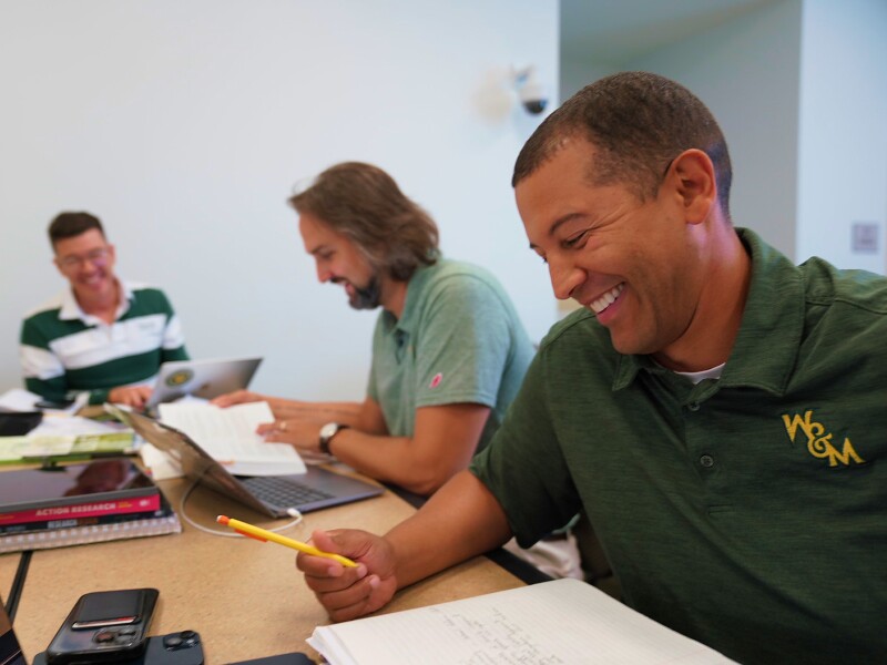 Three William and Mary students studying together