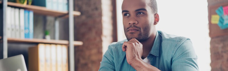 Man is making decision sitting at the office